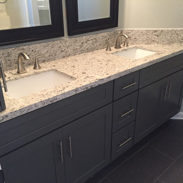 Dark grey shaker bathroom vanity with quartz countertops