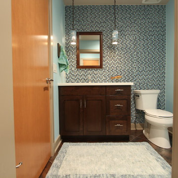 Dark Stained Shaker Style Vanity with Full Tile Wall