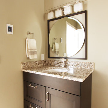 Dark Stained Vanity with Natural Stone and Glass Tile