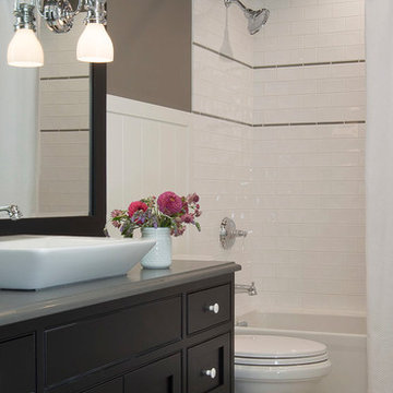 Dark Wood Vanity Bathroom with Marble Flooring St. Louis, MO