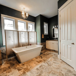 Inspiration for a large transitional master freestanding bathtub remodel in Charleston with shaker cabinets, white cabinets, green walls and an undermount sink
