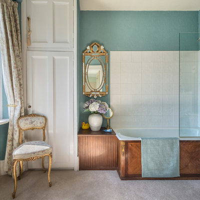 Example of a mid-sized ornate master white tile and ceramic tile bathroom design in Devon with a two-piece toilet