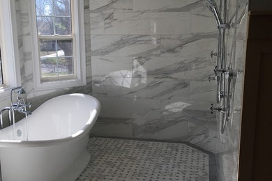 Example of a mid-sized classic master white tile and porcelain tile porcelain tile bathroom design in New York with furniture-like cabinets, gray cabinets, a one-piece toilet, an undermount sink and marble countertops