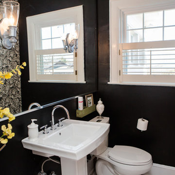 Dawn D Totty  DESIGNS- Powder room has repurposed the existing wall sconces & re