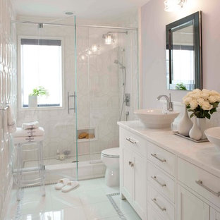 Mid-sized transitional bathroom in New York with a vessel sink, shaker cabinets, white cabinets, an alcove shower, white tile, marble benchtops, glass tile, purple walls, white floor and white benchtops.