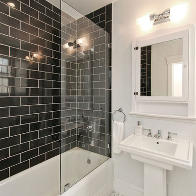 Example of a mid-sized trendy master black tile and subway tile ceramic tile bathroom design in San Francisco with a two-piece toilet, a pedestal sink, white walls and a hinged shower door