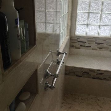 Decorative grab bar recessed niches and bench seat in a roll in shower Hilliard