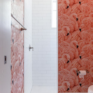 Mid-sized eclectic white tile and subway tile porcelain tile and white floor open shower photo in Jacksonville with beaded inset cabinets, white cabinets, a two-piece toilet, pink walls, an undermount sink and quartz countertops