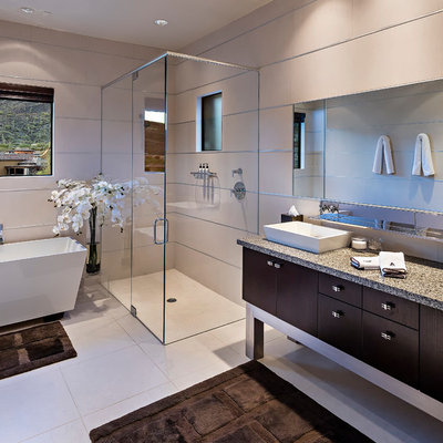 Trendy master bathroom photo in Phoenix with a vessel sink, flat-panel cabinets and dark wood cabinets