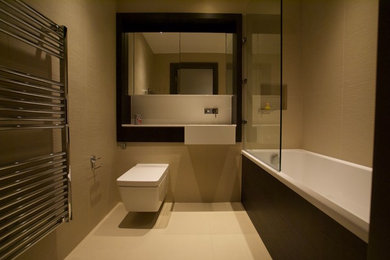 This is an example of a bathroom in London with beige walls.