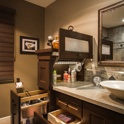Transitional bathroom photo in Omaha with a vessel sink, recessed-panel cabinets, dark wood cabinets and brown walls
