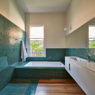 Bathroom - contemporary blue tile, green tile and mosaic tile medium tone wood floor and turquoise floor bathroom idea in Melbourne with flat-panel cabinets, white cabinets and an undermount sink