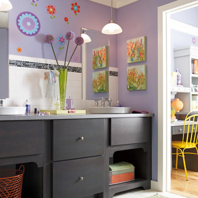 Bathroom - mid-sized eclectic kids' subway tile ceramic tile bathroom idea in Indianapolis with a vessel sink, flat-panel cabinets, black cabinets, purple walls and limestone countertops