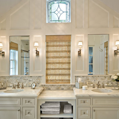 Bathroom - large traditional master white tile and marble tile marble floor bathroom idea in New York with an undermount sink, recessed-panel cabinets, white cabinets, marble countertops, gray walls and white countertops
