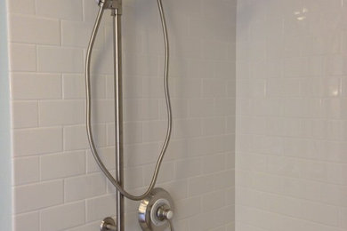 Transitional white tile doorless shower photo in Other