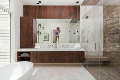 Inspiration for a mid-sized contemporary master gray tile and marble tile marble floor and gray floor bathroom remodel in San Francisco with flat-panel cabinets, medium tone wood cabinets, a two-piece toilet, gray walls, an undermount sink, marble countertops, a hinged shower door and gray countertops
