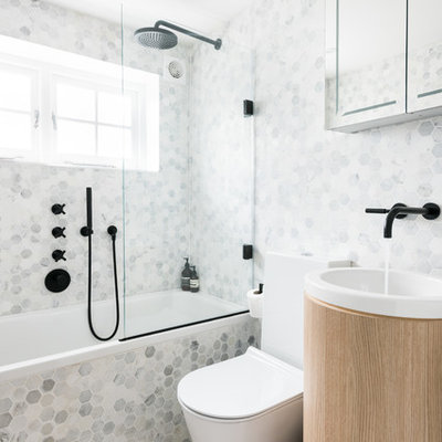 Bathroom - contemporary multicolored tile and mosaic tile beige floor bathroom idea in London with a one-piece toilet and a pedestal sink