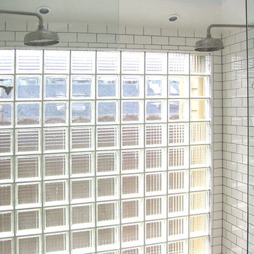Double shower heads provides spray for two.