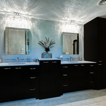 Double vanity with crystal pendant light bars.