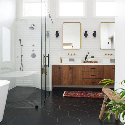 Mid-sized 1950s master white tile and ceramic tile porcelain tile and black floor bathroom photo in Orange County with flat-panel cabinets, dark wood cabinets, white walls, a vessel sink, quartz countertops and a hinged shower door