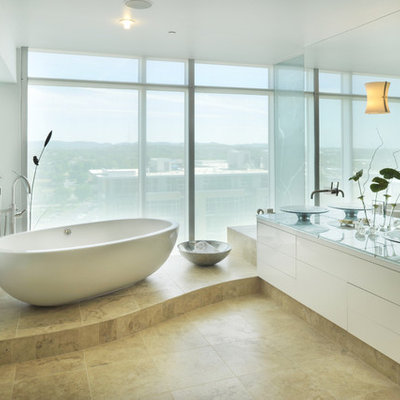 Trendy freestanding bathtub photo in Nashville with a vessel sink