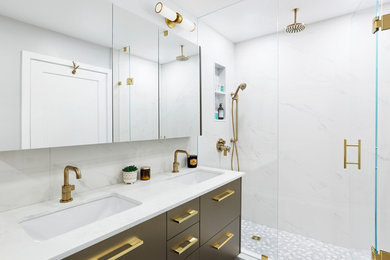 Inspiration for a medium sized modern ensuite bathroom in Toronto with flat-panel cabinets, grey cabinets, an alcove bath, an alcove shower, a two-piece toilet, white tiles, porcelain tiles, grey walls, porcelain flooring, a submerged sink, engineered stone worktops, grey floors, a hinged door and white worktops.