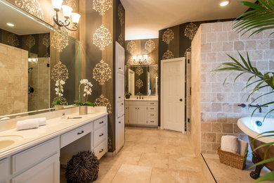 Mid-sized elegant master beige tile and stone tile porcelain tile bathroom photo in Dallas with an integrated sink, raised-panel cabinets, white cabinets, solid surface countertops, a one-piece toilet and beige walls