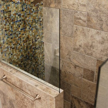 Dramatic mix of a glass wall with stone sides