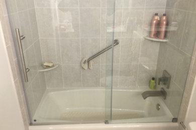 Bathroom photo in Philadelphia with a hinged shower door