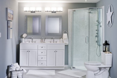 Inspiration for a mid-sized transitional master white tile and ceramic tile ceramic tile and gray floor corner shower remodel in New Orleans with louvered cabinets, white cabinets, a two-piece toilet, gray walls, an undermount sink, a hinged shower door and white countertops