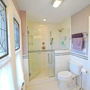 Alcove shower - mid-sized contemporary master white tile and porcelain tile porcelain tile and white floor alcove shower idea in Cleveland with a two-piece toilet, beige walls, an integrated sink and a hinged shower door
