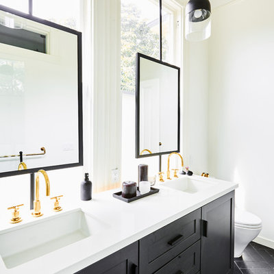 Inspiration for a mid-sized transitional master white tile and porcelain tile marble floor and black floor bathroom remodel in San Francisco with shaker cabinets, black cabinets, a one-piece toilet, white walls, an undermount sink, quartz countertops and white countertops