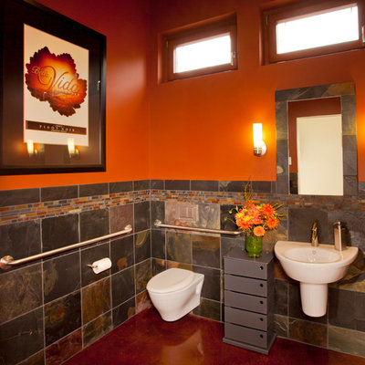 Inspiration for a contemporary multicolored tile and slate tile bathroom remodel in Portland with a wall-mount sink, a wall-mount toilet and orange walls