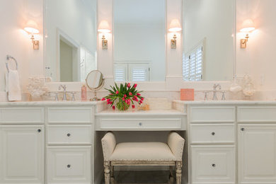 Bathroom - traditional master marble tile marble floor bathroom idea in Charleston with raised-panel cabinets, white cabinets, white walls, an undermount sink and marble countertops