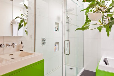 Trendy white tile ceramic tile bathroom photo in Montreal with a vessel sink, flat-panel cabinets and green cabinets