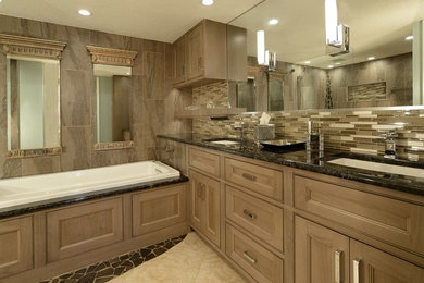 Example of an arts and crafts master gray tile bathroom design in San Diego with beaded inset cabinets, white cabinets, gray walls, an undermount sink and granite countertops