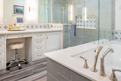Inspiration for a large transitional master blue tile and porcelain tile vinyl floor, gray floor and double-sink bathroom remodel in Other with beaded inset cabinets, gray cabinets, an undermount tub, a one-piece toilet, gray walls, an undermount sink, quartz countertops, a hinged shower door, white countertops and a built-in vanity