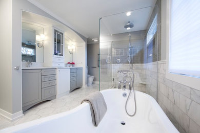 Example of a large classic master white tile and marble tile marble floor and white floor bathroom design in Grand Rapids with shaker cabinets, gray cabinets, a one-piece toilet, gray walls, an undermount sink, marble countertops and a hinged shower door