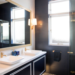 This is an example of a mid-sized contemporary kids bathroom in Sydney with furniture-like cabinets, blue cabinets, a corner shower, blue tile, porcelain tile, white walls, porcelain floors, a vessel sink, engineered quartz benchtops, blue floor, a hinged shower door and white benchtops.