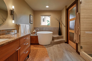 This is an example of a medium sized contemporary ensuite bathroom in Portland with medium wood cabinets, a japanese bath, a walk-in shower, beige tiles, porcelain tiles, beige walls, porcelain flooring, a submerged sink and granite worktops.