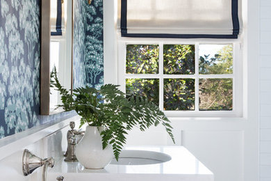 Inspiration for a transitional white floor bathroom remodel in Other with shaker cabinets, blue cabinets, a two-piece toilet, an undermount sink, marble countertops and white countertops