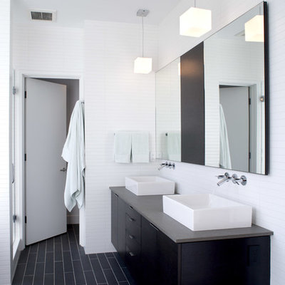 Inspiration for a modern black floor bathroom remodel in Seattle with a vessel sink
