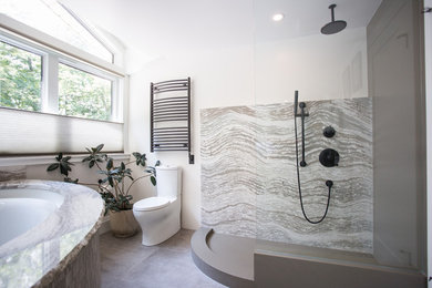 Example of a large minimalist master white tile gray floor bathroom design in Other with shaker cabinets, gray cabinets, an undermount tub, a one-piece toilet, white walls, a vessel sink and quartz countertops