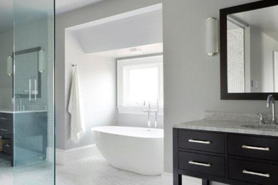 Example of a large minimalist master marble floor bathroom design in Ottawa with flat-panel cabinets, beige cabinets, a one-piece toilet, white walls, a drop-in sink and marble countertops