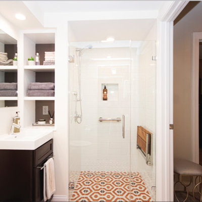 Inspiration for a small eclectic master white tile and subway tile mosaic tile floor and orange floor walk-in shower remodel in Providence with recessed-panel cabinets, dark wood cabinets, a two-piece toilet, beige walls, a drop-in sink and a hinged shower door