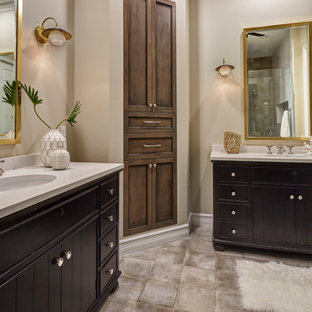 This is an example of a mid-sized eclectic master bathroom with furniture-like cabinets, brown cabinets, an alcove shower, a two-piece toilet, white tile, ceramic tile, an undermount sink, engineered quartz benchtops, a hinged shower door, white benchtops, a double vanity and a freestanding vanity.