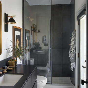 Eclectic Guest Bathroom with large Black Tile