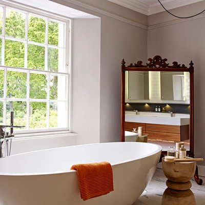 Inspiration for a mid-sized eclectic multicolored tile and porcelain tile marble floor bathroom remodel in Devon with a wall-mount sink, a wall-mount toilet and gray walls