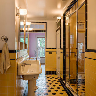 Large elegant master white tile and ceramic tile ceramic tile and yellow floor bathroom photo in New York with yellow walls, a pedestal sink and a hinged shower door