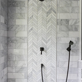 Example of a large master gray tile and marble tile marble floor, white floor, double-sink, vaulted ceiling and wood wall bathroom design in Philadelphia with medium tone wood cabinets, a bidet, gray walls, an undermount sink, quartzite countertops, a hinged shower door, white countertops and a built-in vanity
